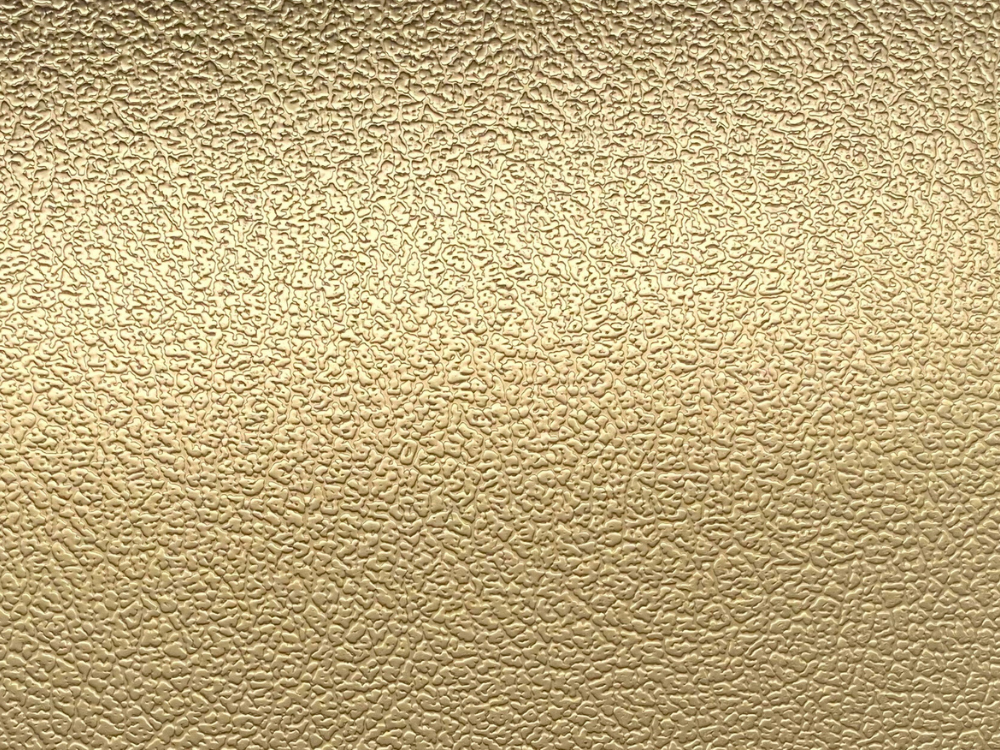 Ledermotief patroon in RVS met warme gouden PVD Gold-TiN coating