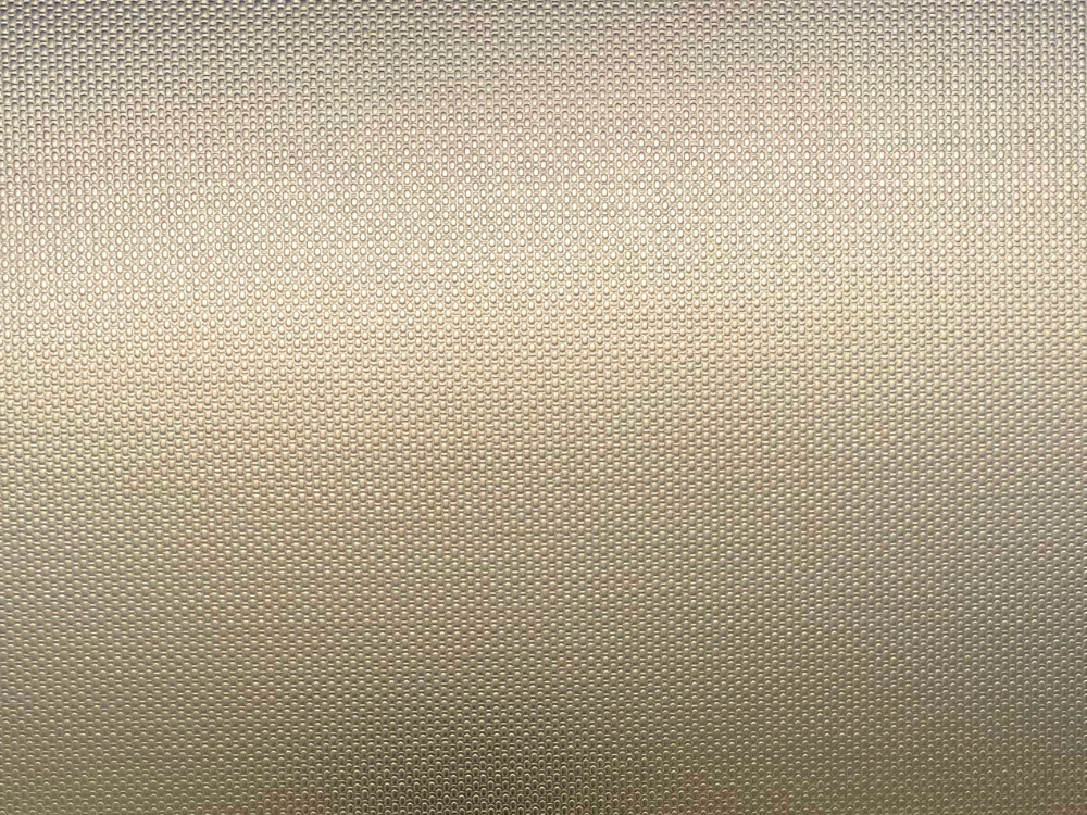 Linnenmotief patroon in RVS met een warme champagne Gold-TiN coating