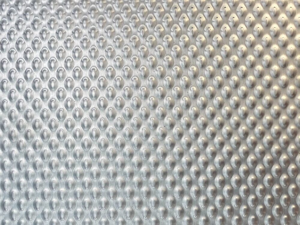 Close-up van geborsteld RVS met 6WL-wafelpatroon